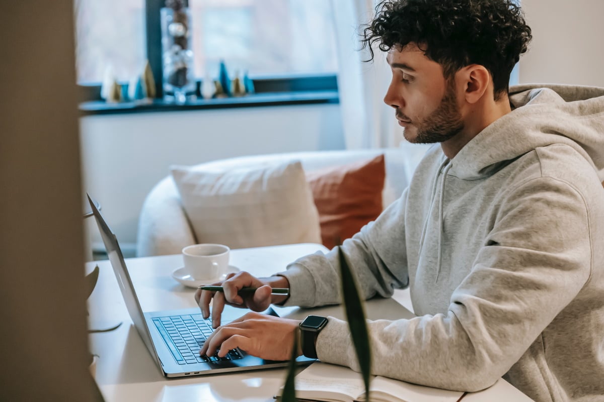 Man sat at a laptop orking from home