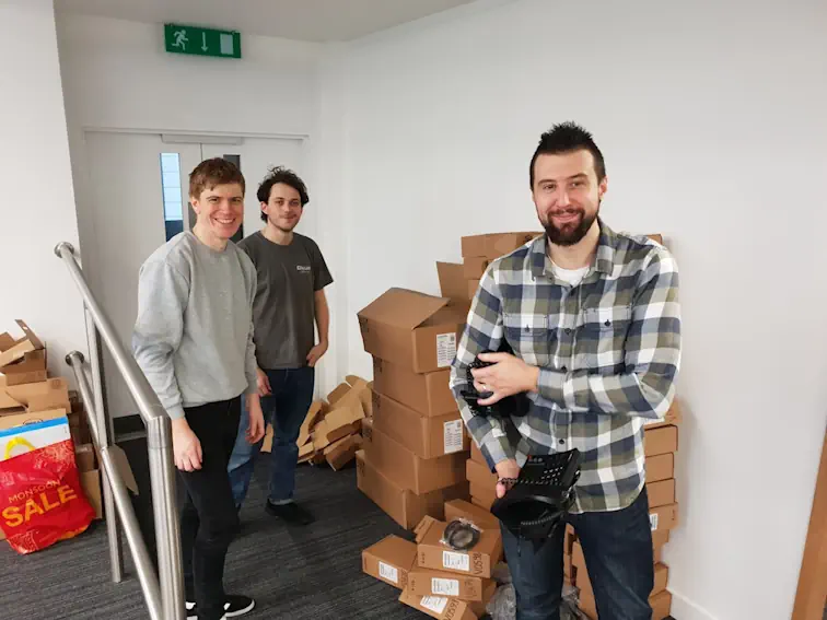 Three members of ITbuilder working on an office move