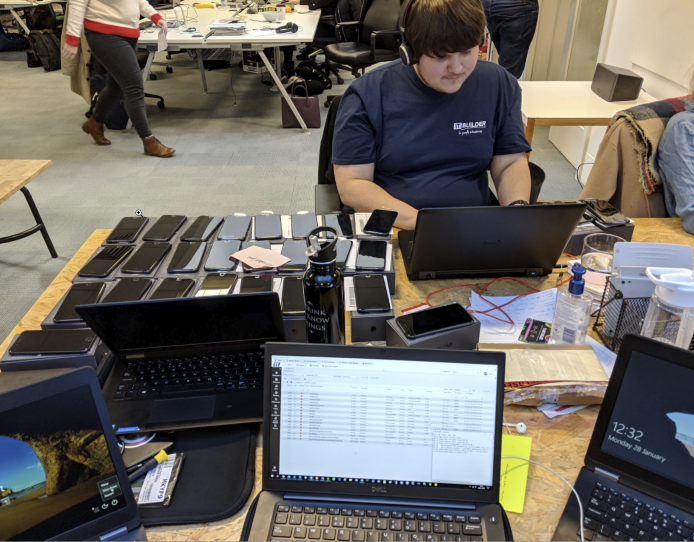Technicians working on a production line of laptops