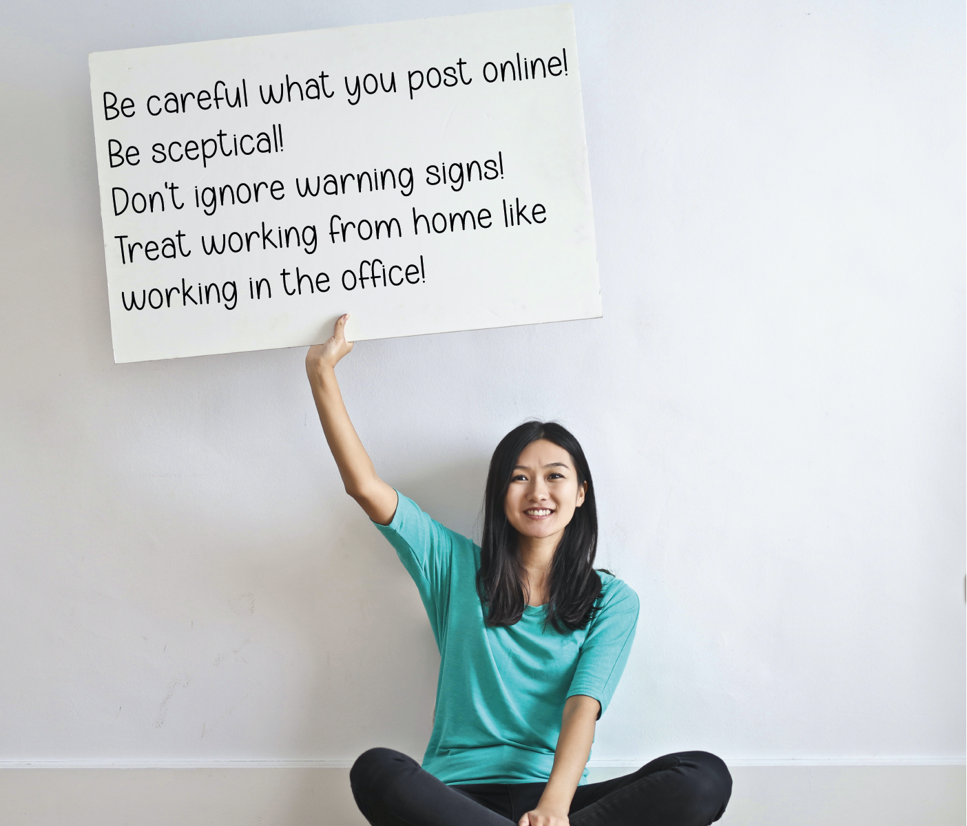 Woman holding a placard with text written on it