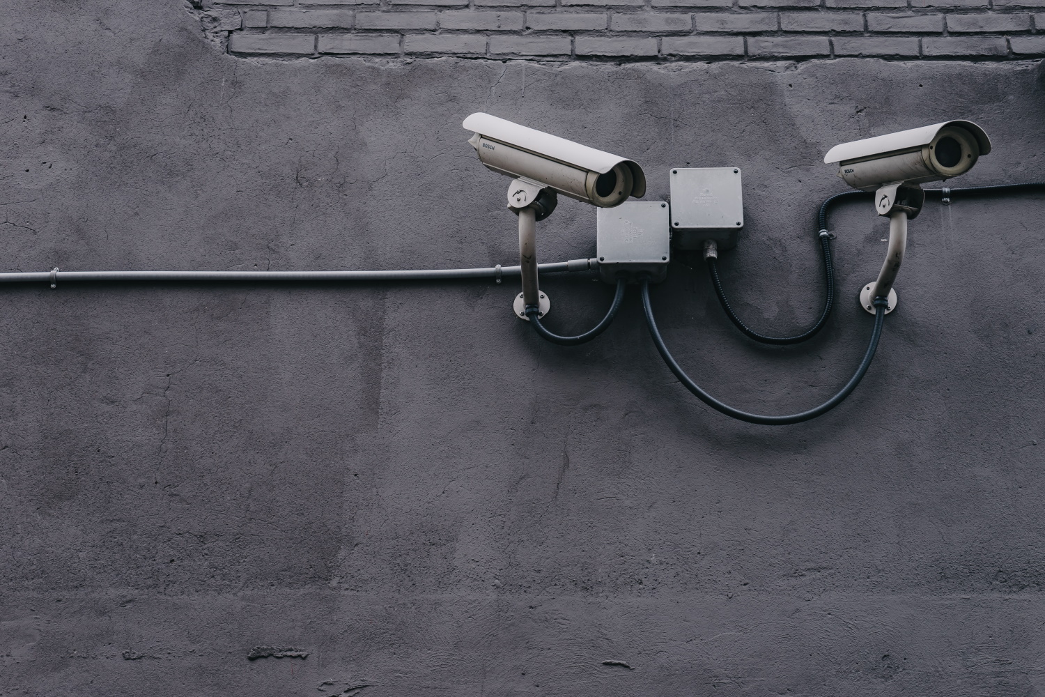 CCTV cameras mounted to a wall