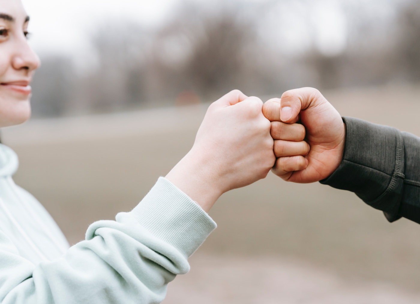 Two people engaged in a fist bump