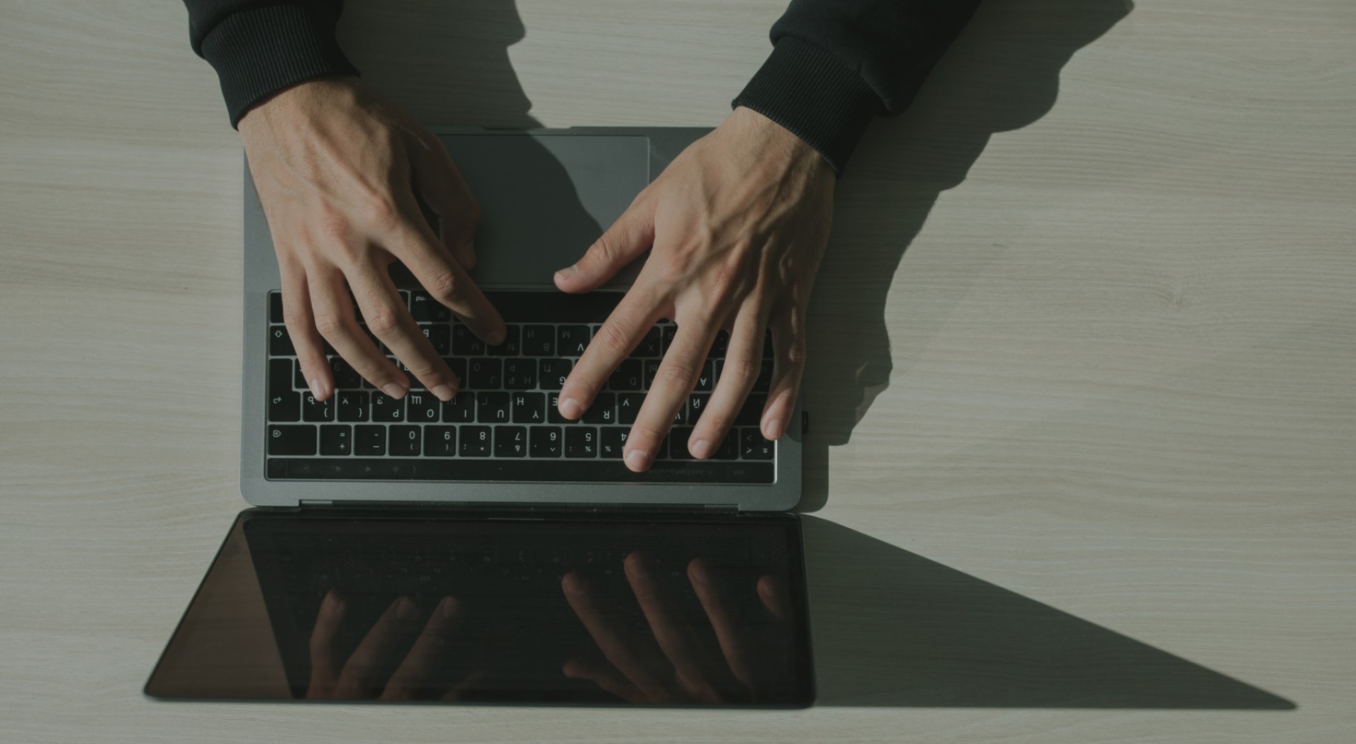 Bird's eye view of a man working on his laptop